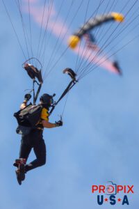Para Commandos parachute team delivering the American flag to the opening ceremony of the 2025 Augusta Georgia airshow. Airport code(s): KAGS, AGS