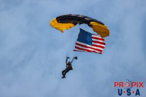Para Commandos parachute team delivering the American flag to the opening ceremony of the 2025 Augusta Georgia airshow. Airport code(s): KAGS, AGS