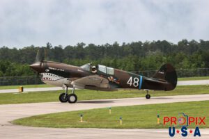 Tex wavin Howdy..! N1226N 1943 Curtis Wright P-40 flown by D.L. "Tex" hill at the 2025 Brunswick Georgia airshow. Aircraft code: P40 Airport code(s): BQK, KBQK Photo date: 5-17-2025