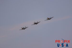 N51MX 1945 North American P-51 Mustang (Mad Max) N51LW 1962 North American P-51 Mustang (The Little Witch) N5444V 1944 North American P-51 Mustang (Miss Kandy) performing at dusk during the 2025 Sun N Fun airshow in Lakeland Florida. Aircraft code: P51 Airport code(s): KLAL, LAL