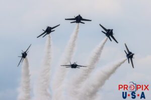 The Blue Angels perform the "Delta Break Head on" at the 2025 Brunswick Georgia airshow. #1 Commander Adam Bryan (Commanding Officer) Photo top center #2 Commander Jack Keilty (Right Wing) Photo left center #3 Major Brandon Wilkins (Left Wing) Photo Right center #4 Lieutenant Commander Wes Perkins (Slot) Photo bottom center #5 Commander Thomas Zimmerman (Lead Solo) Photo far right #6 Lieutenant Commander Connor O'Donnell (opposing Solo) Photo far left Aircraft code: F18 Airport code(s): BQK, KBQK Photo date: 5-17-2025