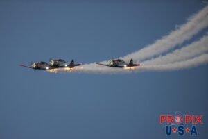 Titan Aerobatic team night performance at the 2025 Sun N Fun airshow in Lakeland Florida. #1 N791MH 1951 North American T-6 Texan. Mark Henley Team Lead #2 N3267G 1943 North American T-6 Texan. Bryan Regan Right Wing #3 N7462C 1958 North American T-6 Texan Steve Gustafson Left Wing Aircraft code: T6 Airport code(s): KLAL, LAL