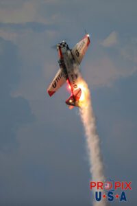 Titan Aerobatic team night performance at the 2025 Sun N Fun airshow in Lakeland Florida. #3 N7462C 1958 North American T-6 Texan Steve Gustafson Left Wing Aircraft code: T6 Airport code(s): KLAL, LAL