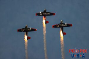 Titan Aerobatic team night performance at the 2025 Sun N Fun airshow in Lakeland Florida. #1 N791MH 1951 North American T-6 Texan. Mark Henley Team Lead #2 N3267G 1943 North American T-6 Texan. Bryan Regan Right Wing #3 N7462C 1958 North American T-6 Texan Steve Gustafson Left Wing Aircraft code: T6 Airport code(s): KLAL, LAL
