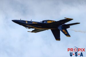 Blue Angel #5 seen approaching show center as he and the #6 aircraft (not seen) are setting up to demonstrate the "Opposing Four Point Roll". #5 Commander Thomas Zimmerman (Lead Solo) Aircraft code: F18 Airport code(s): KAGS, AGS