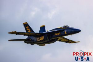 Blue Angel #5 approaches show center where he will cross paths with solo #6 to perform the "Opposing Four Point Roll" at the 2025 Augusta Georgia airshow. #5 Commander Thomas Zimmerman (Lead Solo) Aircraft code: F18 Airport code(s): KAGS, AGS