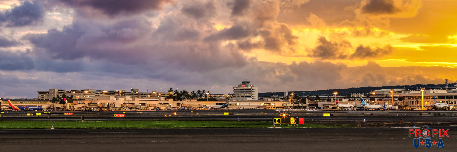 Honolulu airport at sunrise. Honolulu International Airport bathing in warm tropical sunlight as another beautiful Hawaiian Morning is getting underway.