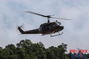 A U.S. Army Huey helicopter performing a mock military exercise at the 2025 Augusta Georgia airshow. Aircraft code: UH1 Airport code(s): KAGS, AGS