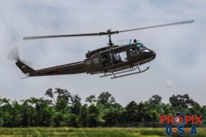 A U.S. Army Huey helicopter performing a mock military exercise at the 2025 Augusta Georgia airshow. Aircraft code: UH1 Airport code(s): KAGS, AGS