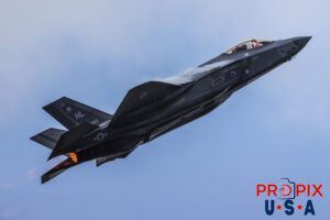 Where the hell are the brakes..? This super clear and closeup image is of Major Melanie "MACH" Kluesner performing a rapid ascent in her F-35 Lightning with the afterburner engaged at the 2025 Sun N Fun airshow in Lakeland Florida. The agressiveness of this sudden climb is confirmed by the condensation vapors forming near the engine intakes. Aircraft code: F35 Airport Code(s): KLAL, LAL