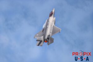 Not out of bounds... yet..! Major Melanie "MACH" Kluesner was performing a rapid ascent in her F-35 Lightning with the afterburner engaged at the 2025 Sun N Fun airshow in Lakeland Florida. The agressiveness of this sudden climb is confirmed by the condensation vapors forming near the engine intakes and the raging hot exhaust port. Aircraft code: F35 Airport Code(s): KLAL, LAL