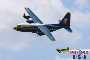 Mike and Albert.. Blue Angels' C-130 "Fat Albert" supply and transport aircraft performing a "Parade Pass" with N821MG (a 2009 Extra EA-300) piloted by Mike Goulian on it's left wingtip at the 2025 Augusta Georgia airshow. Fat Albert Flight Crew: Major Samuel Petko (USMC) Captain Isaac Becker (USMC) Major Josh Horman (USMC) Aircraft code(s): C130, E300 Airport code(s): KAGS, AGS