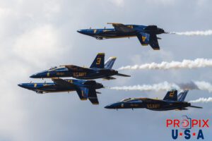 Rubbin may be racin, but it's not advised in aerobatics..! The Blue Angels are performing the "Double Farvel" where #1 & #4 roll simultaneously to the inverted position while maintaining the "Diamond" formation. It is the maneuver where the proximity between the aircraft appears precariously tight as they pass show center. #1 Commander Adam Bryan (Commanding Officer) #2 Commander Jack Keilty (Right Wing) #3 Major Brandon Wilkins (Left Wing) #4 Lieutenant Commander Wes Perkins (Slot) Aircraft code: F18 Airport Code(s): KLAL, LAL