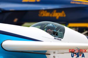 Smilin Mike..! N821MG 2009 Extra EA-300 piloted by Mike Gulian passes in front of the Blue Angels F-18 squadron at the conclusion of his aerobatic performance. Mike was performing at the 2025 Brunswick Georgia airshow. Aircraft code: E300 Airport code(s): BQK, KBQK Photo date: 5-17-2025