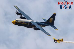 Mike and Albert just passin by. Blue Angels' C-130 "Fat Albert" supply and transport aircraft, performing a "Parade Pass" with N821MG (a 2009 Extra EA-300) piloted by Mike Goulian on it's left wingtip at the 2025 Augusta Georgia airshow. Fat Albert Flight Crew: Major Samuel Petko (USMC) Captain Isaac Becker (USMC) Major Josh Horman (USMC) Aircraft code(s): C130, E300 Airport code(s): KAGS, AGS