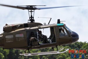 A U.S. Army Huey helicopter performing a mock military exercise at the 2025 Augusta Georgia airshow. Aircraft code: UH1 Airport code(s): KAGS, AGS
