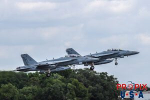 Out for a joy ride..! Two F-18 Super Hornets are seen here taking off to demonstrate some of the capabilities of these fantastic military aircraft. Both of these aircraft are the two seat models that is used primarily for training purposes and giving VIP's a ride they won't forget. If you look closely, you'll see the passengers (in the back seats) of both aircraft firmly holding the handle on the right side of the aircraft. In other pictures from this demonstration the passenger in aircraft number 515, seems to have such an intense grip on the handle, it's a wonder it wasn't pulled off. Aircraft code: F18 Airport code(s): KLAL, LAL