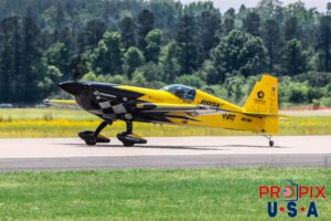 N821MG 2009 Extra EA-300 Mike Goulian does a pass in front of the crowd after his performance at the 2025 Augusta Georgia Airshow. Aircraft Code: E300 Airport Code(s): KAGS, AGS