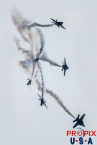 The Blue Angels are performing the "Loop Break" at the 2025 Augusta Georgia airshow. The photo is in color, however the way the sun was striking the airshow, it almost appears to be a black and white photo. #1 Commander Adam Bryan (Commanding Officer) #2 Commander Jack Keilty (Right Wing) #3 Major Brandon Wilkins (Left Wing) #4 Lieutenant Commander Wes Perkins (Slot) #5 Commander Thomas Zimmerman (Lead Solo) #6 Lieutenant Commander Connor O'Donnell (opposing Solo) Aircraft code: F18 Airport code(s): KAGS, AGS