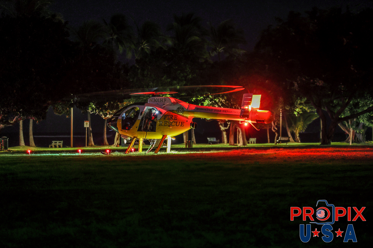 Honolulu Fire and Rescue chopper. A missing kayaker prompted HFD Search and Rescue to conduct a pre-dawn search. Helicopter seen here landed in the Ala Moana beach park to pick up additional personnel.
