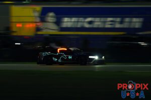 Waving to the pony..! The #64 Ford Mustang roaring past a Michelin trailer in the pre dawn hours of the 2025 Rolex 24 at Daytona.