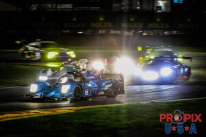 Seeing clearly now..! A fantastic image of the #88 LMP2 car exiting the International Horseshow with a pack of competitors at it's heels in the pre dawn hours of the 2025 Rolex 24 at Daytona.