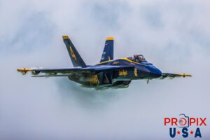 Blue Angels #4 piloted by Lieutenant Commander Amanda Lee performing a high speed, low altitude pass over Pensacola beach florida. A vapor cloud had formed around most of her aircraft as her speed approached the speed of sound. #4 Lieutenant Commander Amanda Lee (Slot) Aircraft code: F18 Airshow location: Pensacola Beach, Florida Photo date: 7-13-2024