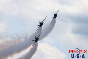 Shortly after takeoff Blue Angels #1,#2 and #3 are initiating the "Diamond Half Cuban Eight On Takeoff"... while they await the arrival of #4. #1 Commander Adam Bryan (Commanding Officer) #2 Commander Jack Keilty (Right Wing) #3 Major Brandon Wilkins (Left Wing) Aircraft code: F18 Airport code(s): KAGS, AGS