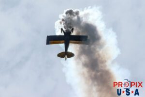 N99MF 1982 Pitts S-2 is flown by Buck Roetman. With the Sun behind the aircraft, the smoke was brilliantly illuminated. Buck was performing a series of aerobatic maneuvers at the 2025 Augusta Georgia airshow Aircraft code: PTS2 Airport code(s): KAGS, AGS