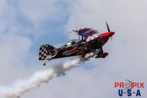 Up in smoke..! Skip Stewart performs a low altitude pass in his 2011 Pitts S-2 aircraft at the Sun N Fun airshow in Lakeland Florida. Aircraft code: PTS2 Airport code(s): KLAL, LAL