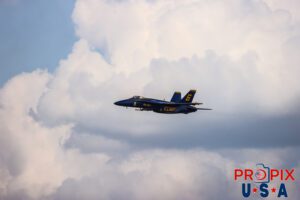 Opposing knife edge. Blue Angel #6 is approaching show center where he and aircraft #5 are about to perform the "Opposing Knife Edge" pass. #6 Lieutenant Connor O'Donnell (opposing Solo) Aircraft code: F18 Airport code(s): KLAL, LAL