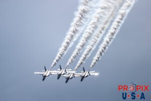 The Blue Angels perform the "Diamond Half Cuban Eight Break Out" maneuver at the 2025 Augusta Georgia airshow. The sunlight reflecting off the aircraft virtually removed all color, creating a dramatic effect. #1 Commander Adam Bryan (Commanding Officer) #2 Commander Jack Keilty (Right Wing) #3 Major Brandon Wilkins (Left Wing) #4 Lieutenant Commander Wes Perkins (Slot) Aircraft code: F18 Airport code(s): KAGS, AGS