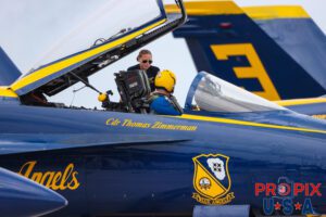 Pre show prep. Blue Angels preparing for the 2025 show in Brunswick Georgia. Navy petty officer Olivia Rauer is helping lead solo Commander Thomas Zimmerman get ready for their demonstration. #5 Commander Thomas Zimmerman (Lead Solo) Aircraft code: F18 Airport code(s): BQK, KBQK Photo Date: 5-17-2025
