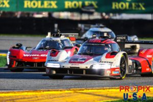 Shut the door..! Sunday morning GTP rush hour at the 2025 Rolex 24 hours at Daytona, exiting the International Horseshoe.