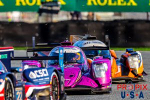 Daytona motorcade..! A recent contender apparently had done a little agricultural excursion and caused grass to be strewn across the track. The current set of cars were doing their best to clear the natural debris off the racing surface.