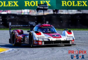 Sunday morning stroll..! The Penske Porsche 967 GTP is approaching the exit of the International Horseshoe at Daytona in the morning hours of Sunday at the 2025 Rolex 24.