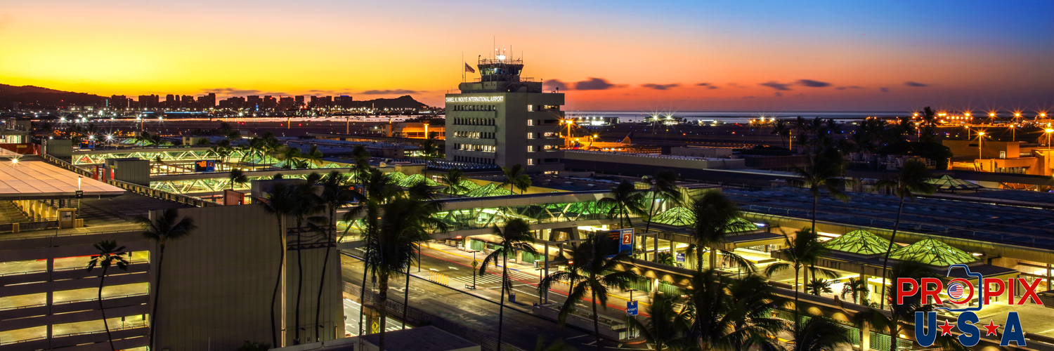 Stunning view of Honolulu airport, the city and Diamondhead at sunrise. A wide angle view of the Honolulu International airport as another dramatic sunrise rises from the East.
