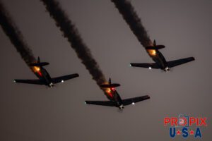 Titan aerobatic. A little smoke and lights (mirrors) makes their flight demonstration somewhat entertaining as their flying skills are less than spectacular. Titan Aerobatic Team performing at the 2025 Sun N Fun night airshow in Lakeland Florida. #1 N791MH 1951 North American T-6 Texan. Mark Henley: Lead Pilot #2 N3267G 1943 North American T-6 Texan. Bryan Regan: Right Wing #3 N7462C 1958 North American T-6 Texan. Steve Gustafson: Left Wing Aircraft code: T6 Airport code(s): KLAL, LAL