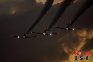 Titan aerobatic. A little smoke and lights (mirrors) makes their flight demonstration somewhat entertaining as their flying skills are less than spectacular. Titan Aerobatic Team performing at the 2025 Sun N Fun night airshow in Lakeland Florida. #1 N791MH 1951 North American T-6 Texan. Mark Henley: Lead Pilot #2 N3267G 1943 North American T-6 Texan. Bryan Regan: Right Wing #3 N7462C 1958 North American T-6 Texan. Steve Gustafson: Left Wing Aircraft code: T6 Airport code(s): KLAL, LAL