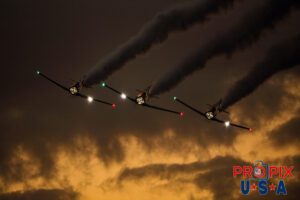 Titan aerobatic. A little smoke and lights (mirrors) makes their flight demonstration somewhat entertaining as their flying skills are less than spectacular. Titan Aerobatic Team performing at the 2025 Sun N Fun night airshow in Lakeland Florida. #1 N791MH 1951 North American T-6 Texan. Mark Henley: Lead Pilot #2 N3267G 1943 North American T-6 Texan. Bryan Regan: Right Wing #3 N7462C 1958 North American T-6 Texan. Steve Gustafson: Left Wing Aircraft code: T6 Airport code(s): KLAL, LAL