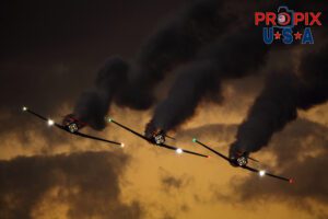 Titan aerobatic. A little smoke and lights (mirrors) makes their flight demonstration somewhat entertaining as their flying skills are less than spectacular. Titan Aerobatic Team performing at the 2025 Sun N Fun night airshow in Lakeland Florida. #1 N791MH 1951 North American T-6 Texan. Mark Henley: Lead Pilot #2 N3267G 1943 North American T-6 Texan. Bryan Regan: Right Wing #3 N7462C 1958 North American T-6 Texan. Steve Gustafson: Left Wing Aircraft code: T6 Airport code(s): KLAL, LAL