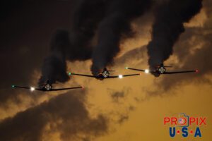 Titan aerobatic. A little smoke and lights (mirrors) makes their flight demonstration somewhat entertaining as their flying skills are less than spectacular. Titan Aerobatic Team performing at the 2025 Sun N Fun night airshow in Lakeland Florida. #1 N791MH 1951 North American T-6 Texan. Mark Henley: Lead Pilot #2 N3267G 1943 North American T-6 Texan. Bryan Regan: Right Wing #3 N7462C 1958 North American T-6 Texan. Steve Gustafson: Left Wing Aircraft code: T6 Airport code(s): KLAL, LAL