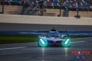 Pullin in for a sip of high octane go-go juice..! As the morning sun was cresting onto the Daytona speedway at the 2024 Rolex 24 hours at Daytona, a BMW GTP car was making a sharp turn towards it's pit box to get fuel and fresh tires.