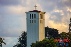 Say your prayers..! The church tower of Saints Peter and Paul overlooking Waimea beach which is surfers Meca in the winter months on Oahu Hawaii's north shore.