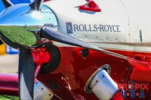 The nose of a modern era aircraft sporting a Rolls Royce power plant. The nosecone reflection is of the huge 2017 Sun N Fun airshow in Lakeland Florida.
