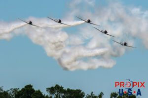 Sky Typers aerobatic team performing at the 2017 Sun N Fun airshow in Lakeland Florida. The aircraft are WWII era North American T-6 Texans. Aircraft code AT6