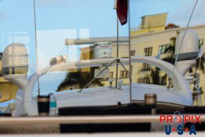 Just reflecting..! Reflection of yachts from another yacht's window.
