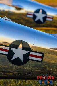 Two identical WWII era aircraft being illuminated by the evening sun at the 2017 Sun N Fun airshow in Lakeland Florida.