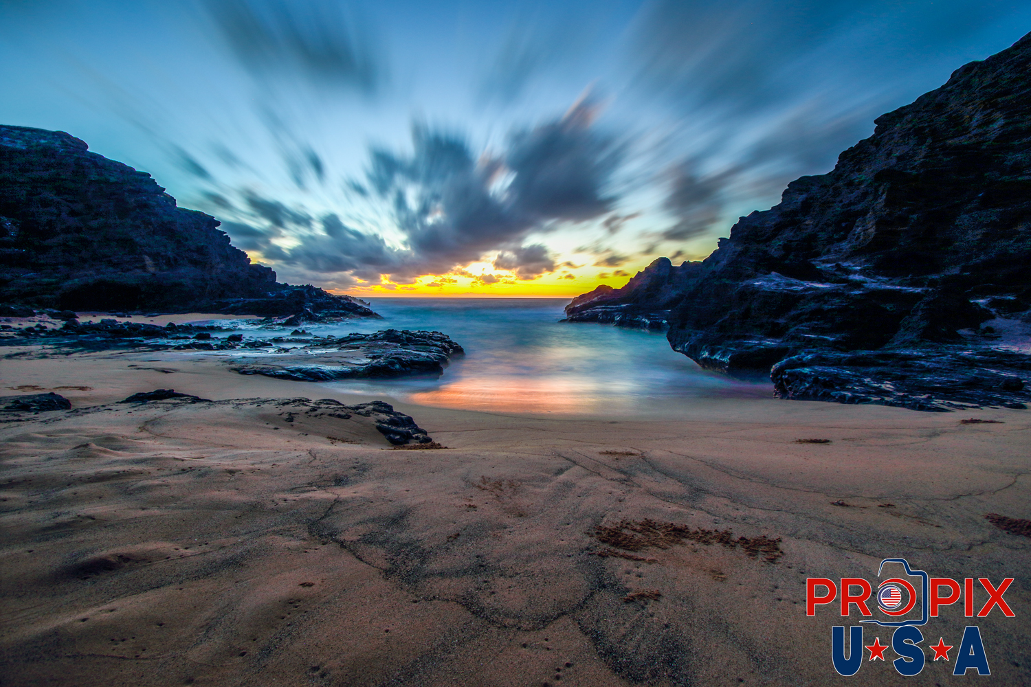 Oahu's Halona Blowhole beach at sunrise. The photo is of the beach near the Halona blowhole and the famous lava tube is directly behind the photo. This is a beautiful a lightly visited location, as it requires scaling a couple hundred foot of large lava rocks. The lava rock deterrent is enough to preserve the serenity of this spectacular location. If only this beach and lava tube could tell stories, it would have many fascinating ones to tell. A couple famous visitors to this location include Elvis and Priscilla Presley, who reportedly loved this site.