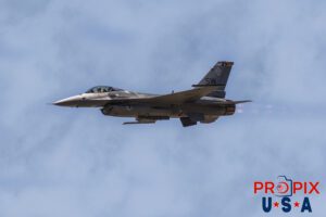 F-16 Performing at the 2017 Sun N Fun airshow in Lakeland Florida. Afterburners are engaged, as evidenced by the faint trail of flames coming from the exhaust. Aircraft code F16.